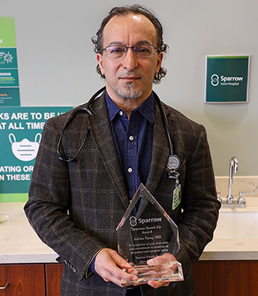 Dr. Adriss Faraj Holds Speak Up Award